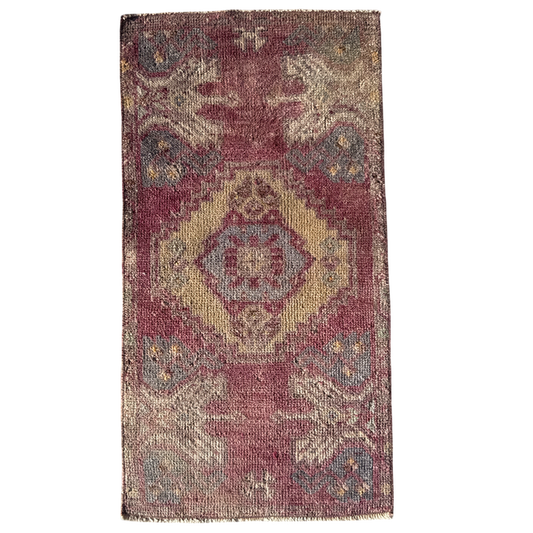 Rectangular rug with a geometric pattern on a white background