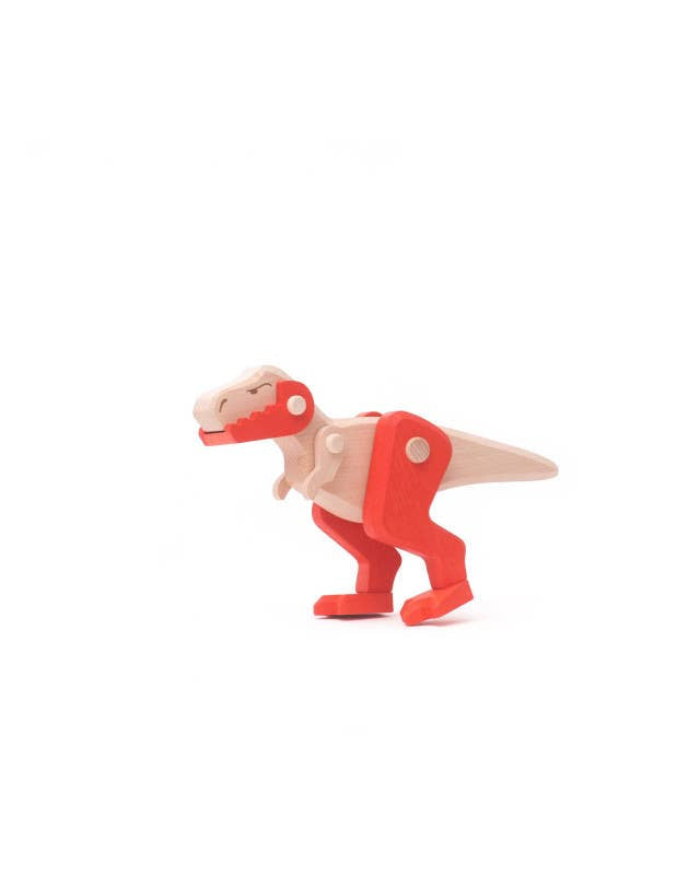 Toy dinosaur with a red exoskeleton on a white background