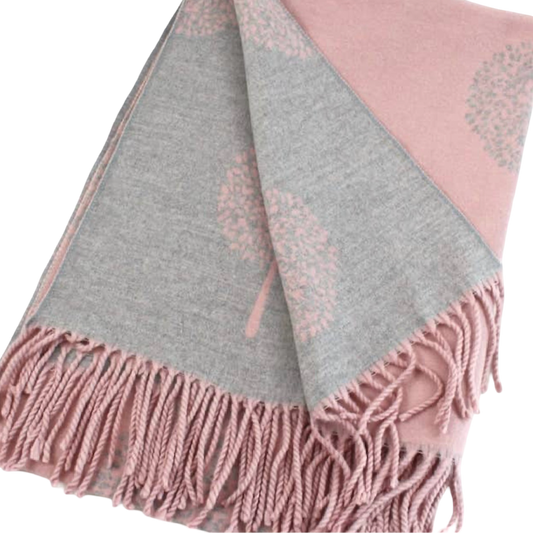 Dusty pink and gray reversible scarf folded to show contrasting tree motifs on both sides, with pink fringe at the ends.